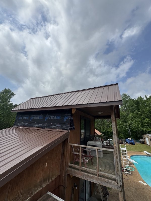 Brown metal roof on a home overlooking the pool deck